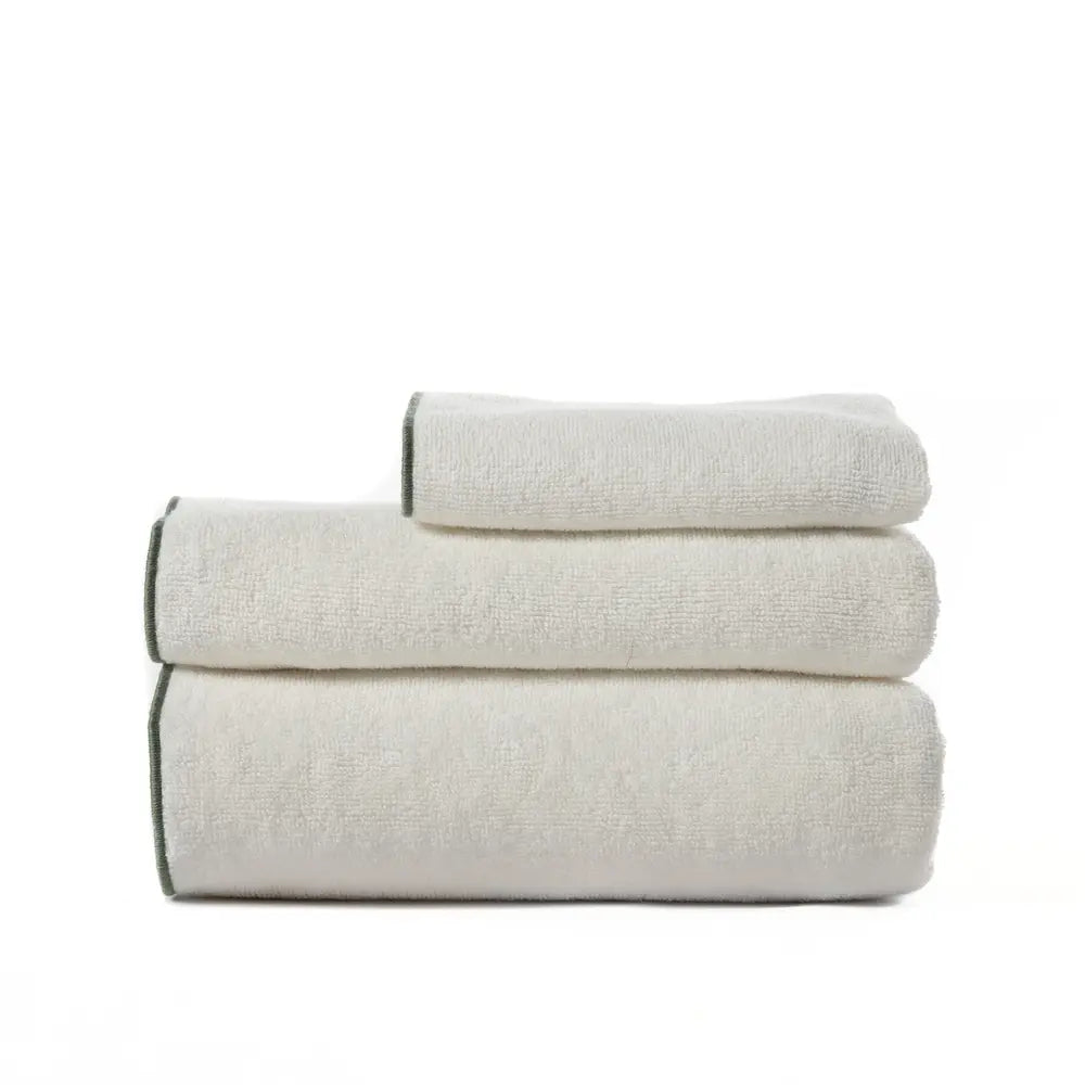 Set of three folded towels on a white background