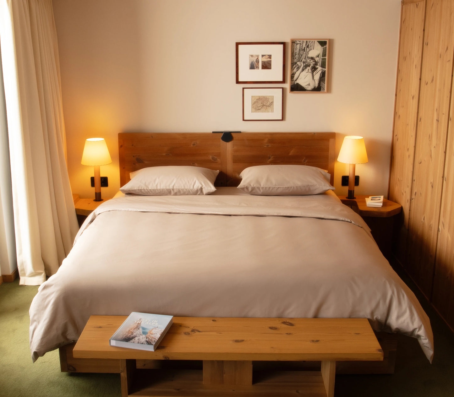 Bedroom with wooden bed, nightstands, and lamps.
