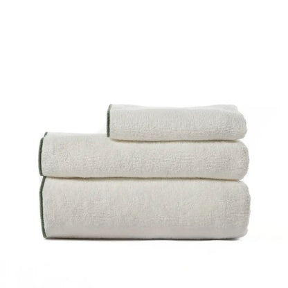 Set of three folded towels on a white background